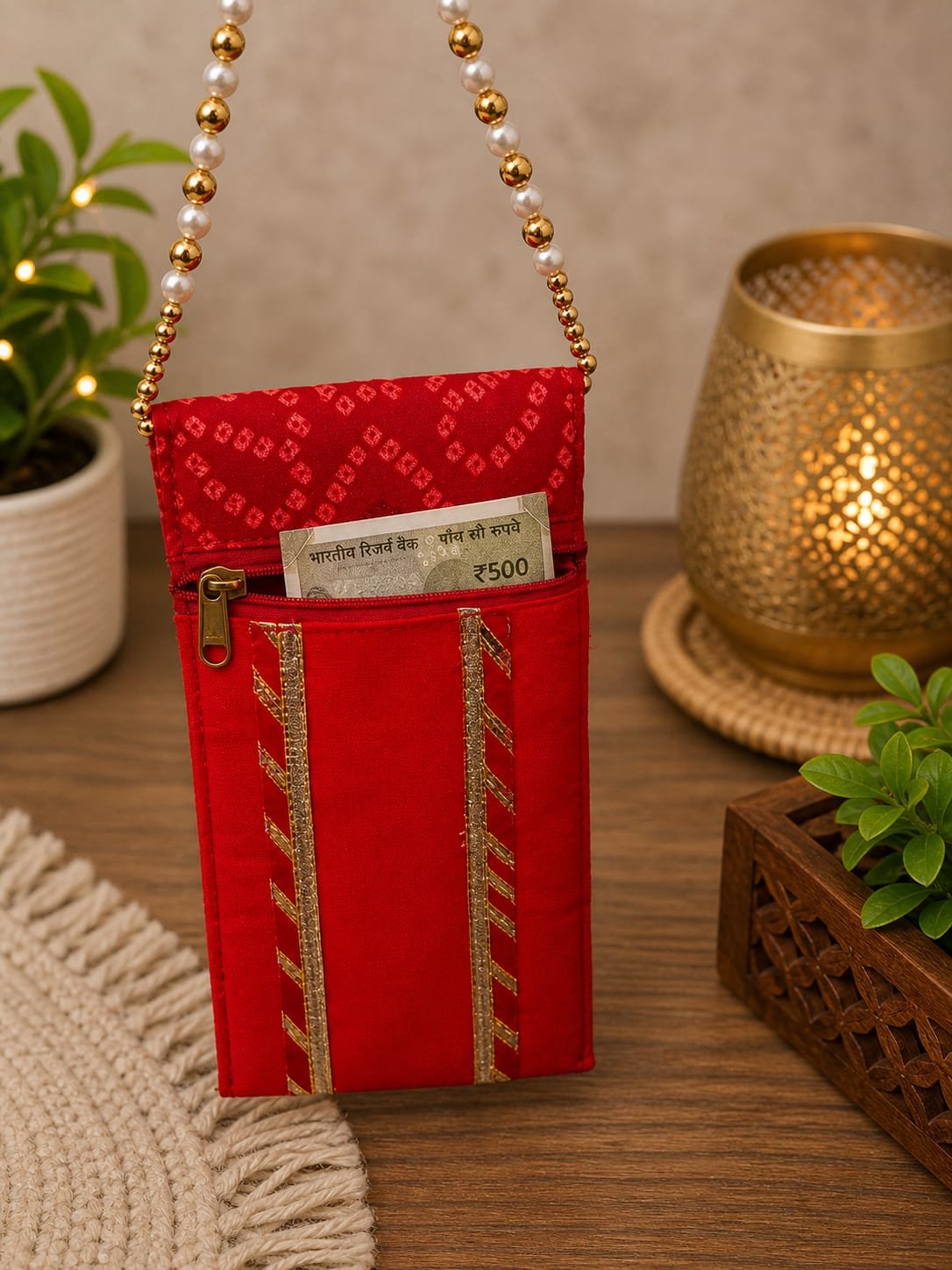 IMG-20260504-WA0059 Handcrafted Red Silk Mobile Cover with Gold Embroidered Border & Pearl Beaded Strap - Image 1