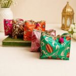 Traditional Floral Print Gift Bags with Golden Lace and Pom-Pom Charms